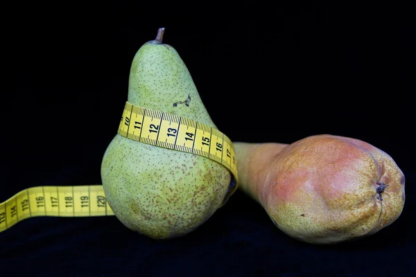 Pear with tape measure — Stock Photo, Image