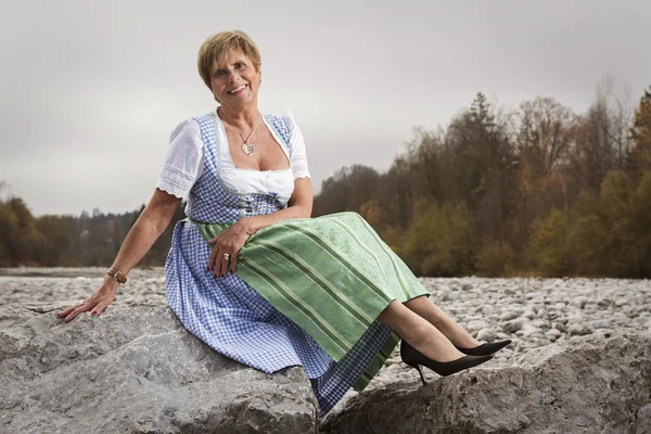 Funny Senior in dirndl dress — Stock Photo, Image