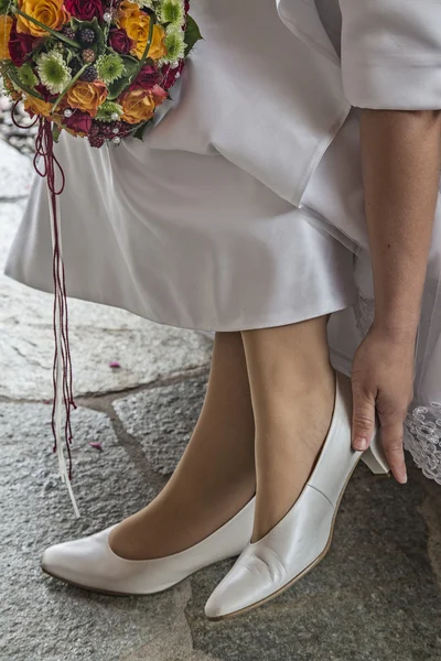 Bride with bridal shoes