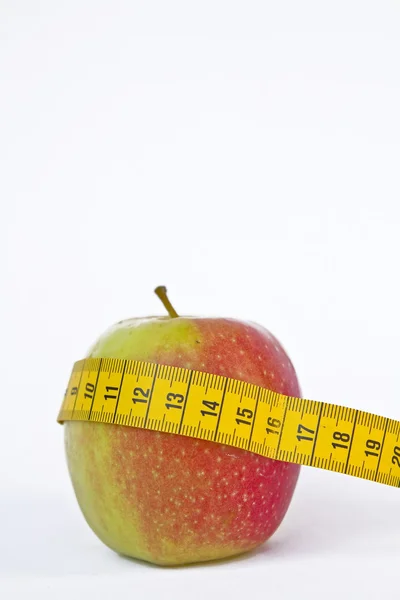 Apple with tape measure — Stock Photo, Image