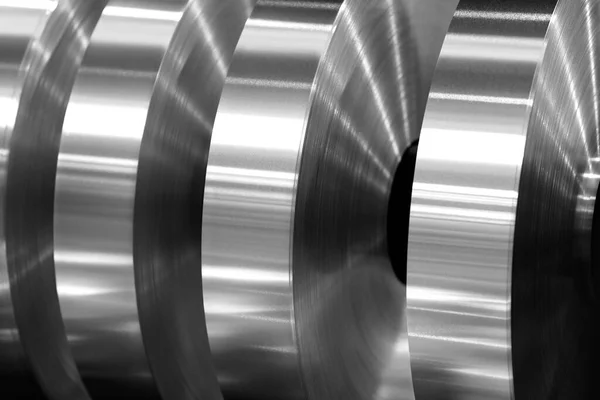 final coils of aluminum foil after sliting on the axis machine, black and white photo