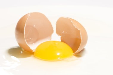 Broken egg with an entire yolk