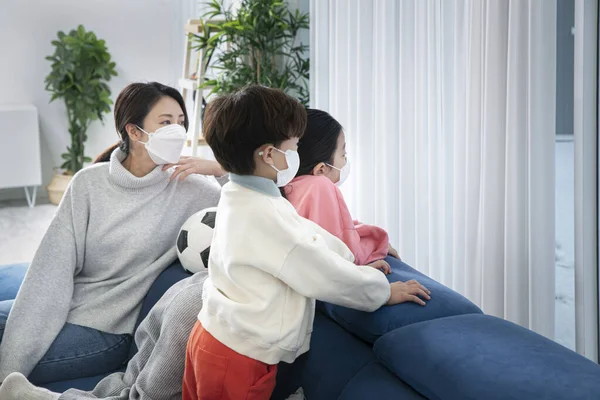 Asian family wearing mask wish to go out and play