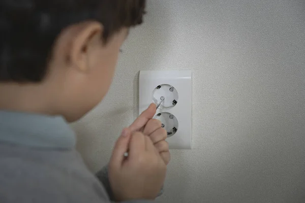 Asian Boy Inserting Finger Electrical Outlet — Stock Photo, Image