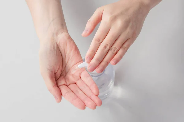using hand sanitizer, disinfect hands