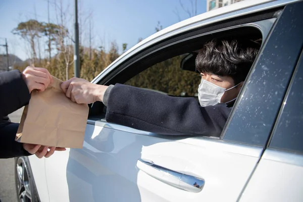 drive through wearing mask in car, covid virus