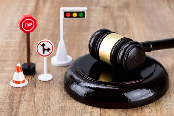Crime and law - miniature traffic signs and gavel
