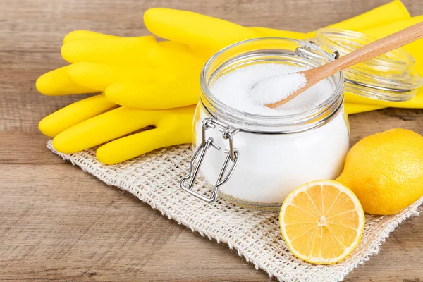 Zero waste cleaning - powdered citric acid, wood spoon and lemon