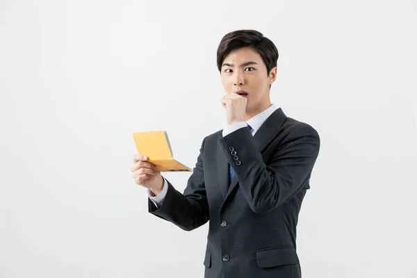 Surprised Asian Man Checking His Balance Bank Book — ストック写真