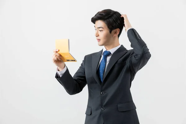 Happy Asian Man Checking His Balance Bank Book — Photo