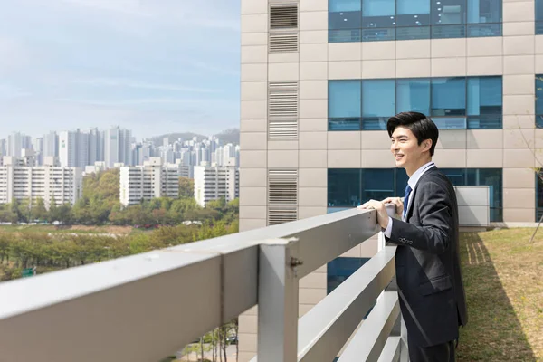 Young Asian Handsome Employee Man Looking City Buildings — Photo