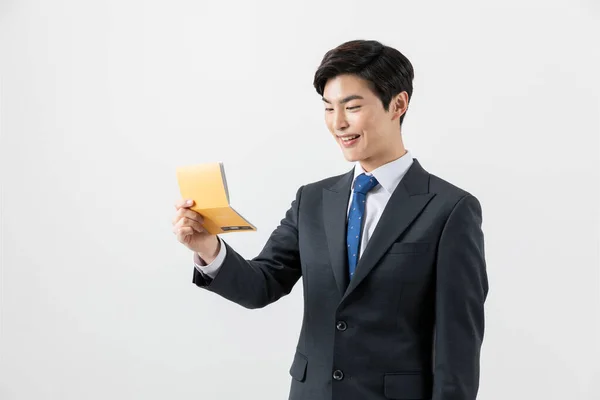 Happy Asian Man Checking His Balance Bank Book — Photo