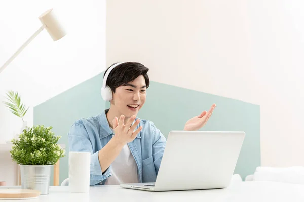 Asian Handsome Young Man Headset Video Calling Using Laptop — Stok fotoğraf