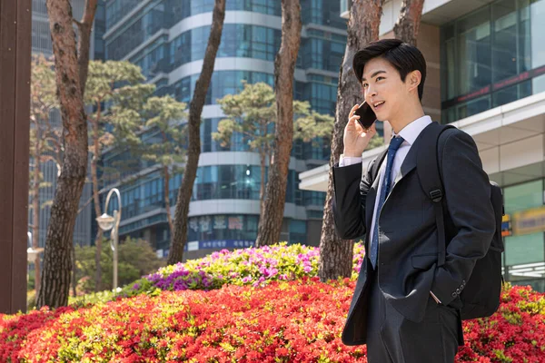 Asian Man Employee Smartphone Company Building Background — Stok fotoğraf