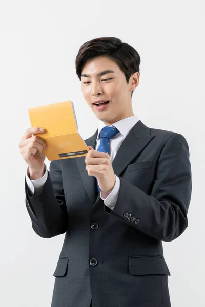 Surprised Asian Man Checking His Balance Bank Book — Photo