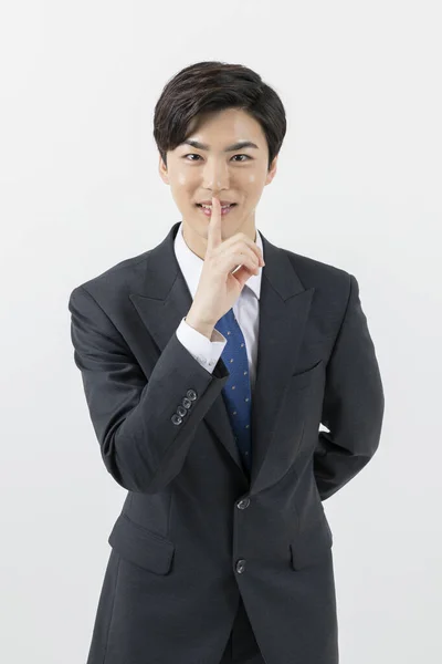 Smiling Asian Man Employee Index Finger Mouth — Stock Photo, Image