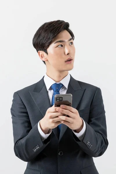 Asian Man Businessman Holding Smartphone Looking Side — Photo