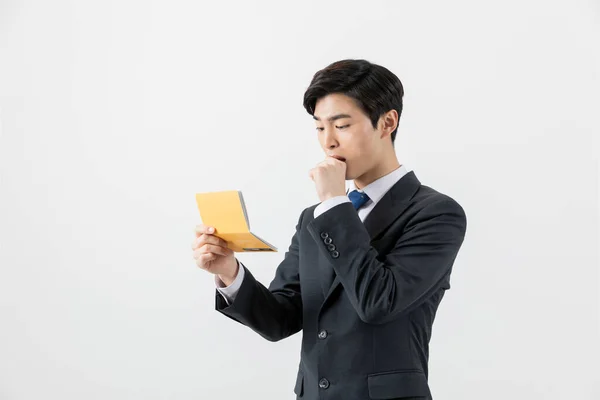 Surprised Asian Man Checking His Balance Bank Book — Photo