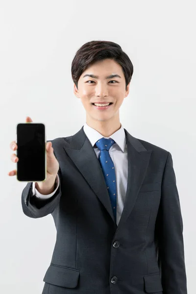 Asian Man Businessman Showing Smartphone — Photo