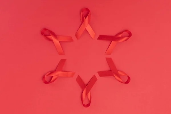 Red Ribbon Placed Star Shape Red Background — Stock Photo, Image