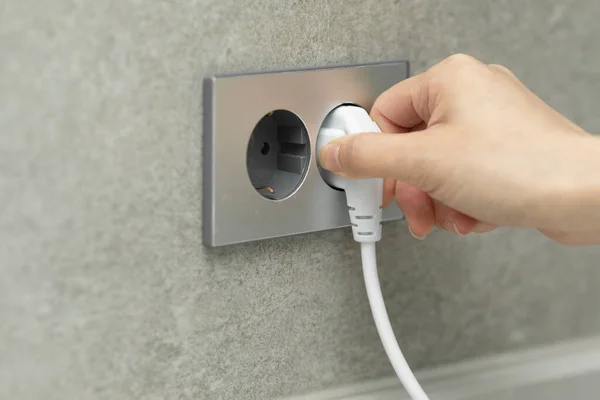 Hand Plugging Out Cord Outlet — Stock Photo, Image