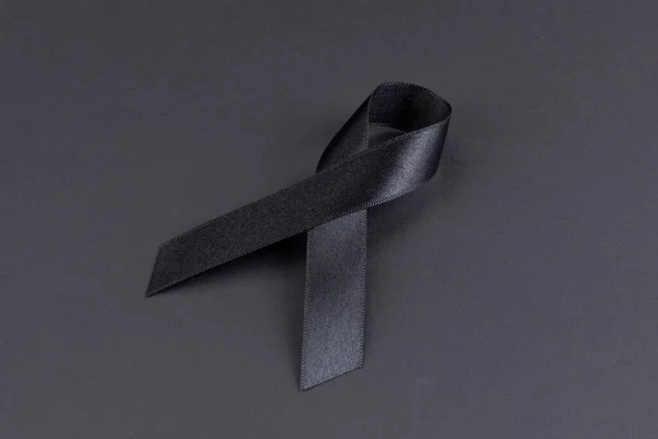 Black ribbon on black background