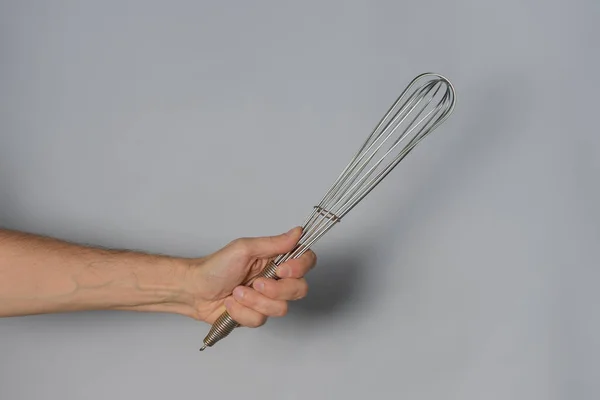 Hand Holding Metallic Whisk White Background — Stock Photo, Image