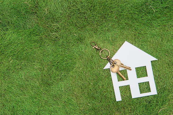 Paper house and key, home environment green living — Stock Photo, Image