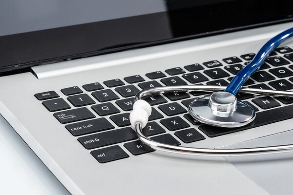 Medical Research, stethoscope on laptop keyboard
