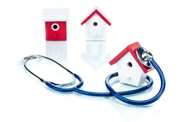 Family health concept, house model with stethoscope — Stock Photo, Image