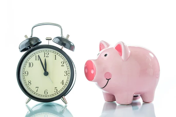 Alarmclock with piggybank on white background — Stock Photo, Image