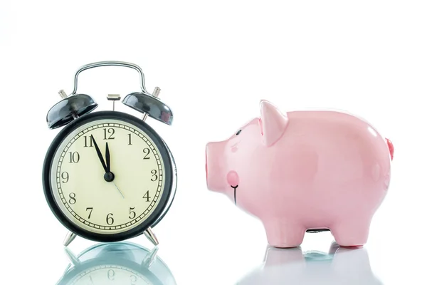 Alarmclock with piggybank on white background — Stock Photo, Image