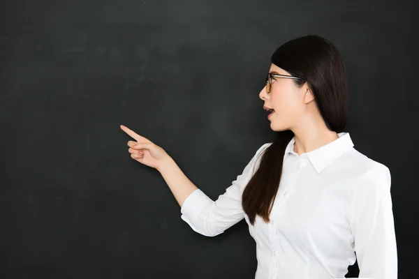 Young asian teacher pointing a question on blackboard — Stock Fotó