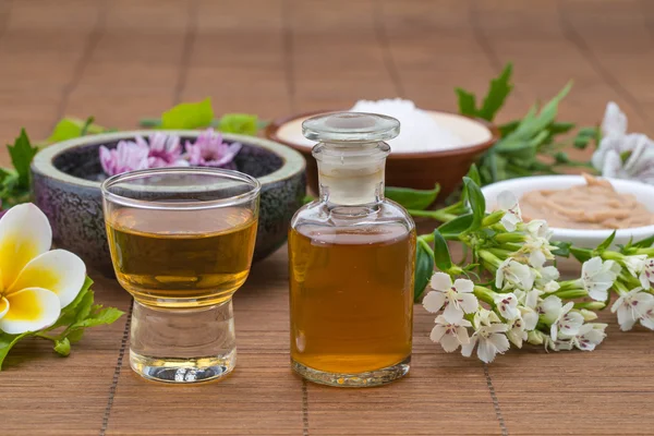 Essential Oil, flower float on water, salt bowel and mask for he — Stock Photo, Image