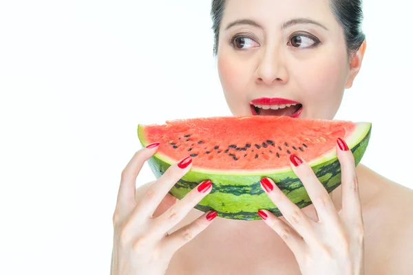 Fashion woman enjoy eating armelon with red lips, Nail Polish — стоковое фото