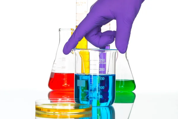 Science Laboratory glassware pipette drop, reflective white back — Stock Photo, Image
