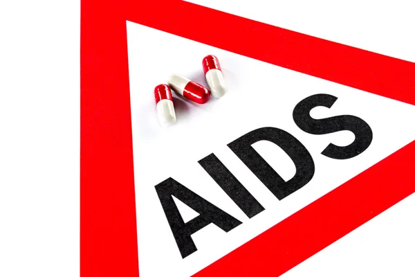 Stop AIDS and HIV, capsule with Warning Sign — Stock Photo, Image