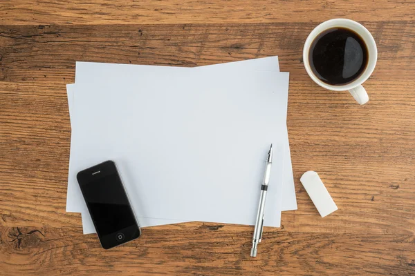 Teléfono inteligente, papel, borrador y lápiz mecánico con café —  Fotos de Stock