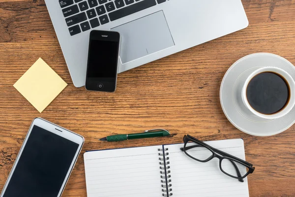 Laptop Mobile Phone and Tablet with notebook on the desk — Stock Photo, Image