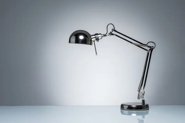 Lighting up office desk lamp for reading  studying — Stock Photo, Image