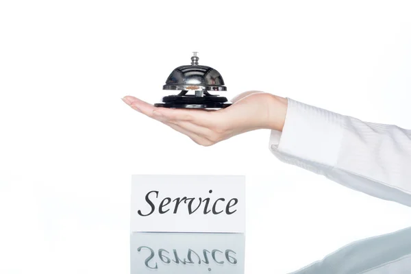 Woman hand holding Service bell with service card — Stock Photo, Image