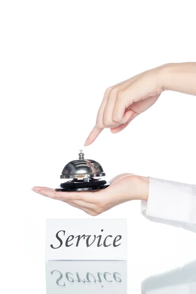 Vrouw hand met Service bell met service card — Stockfoto