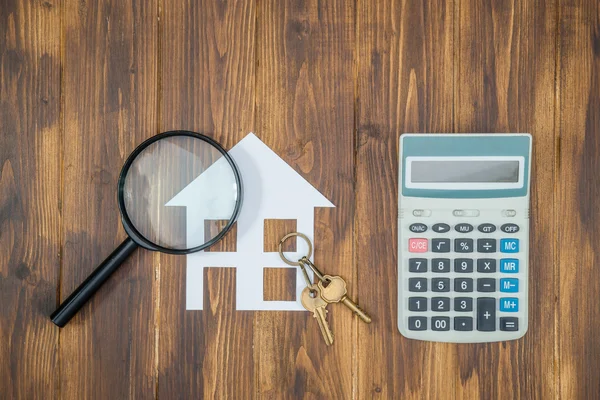 Koupit dům Hypoteční výpočty, kalkulačka s lupou — Stock fotografie