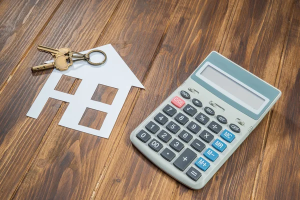 Rekenmachine voor hypotheken, huis en sleutel met Calculator — Stockfoto