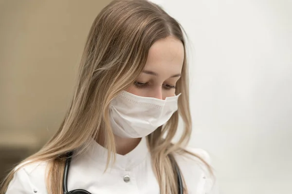 Close-up female doctor's face in medical mask