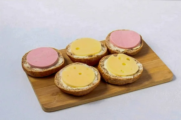 Cut Sausage Cheese Slices Using Small Culinary Ring Cut Circles — Stock Photo, Image
