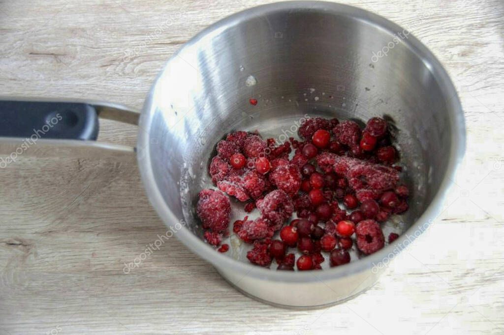Take a handful of frozen berries, grind them with a blender.