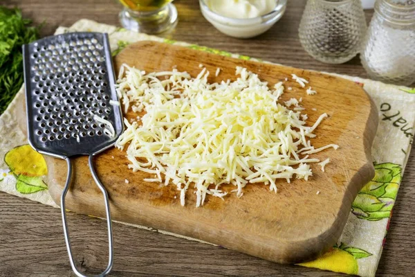 Grate the cheese. Set aside.