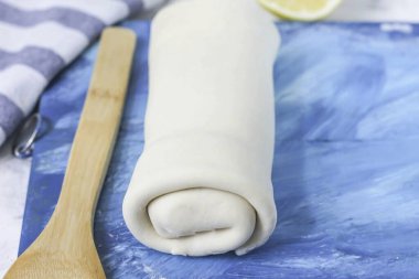 Then roll the filled dough into a roll and place it on parchment paper, covering a baking sheet with it. Preheat oven to 200 degrees and bake strudel for 30 minutes. clipart