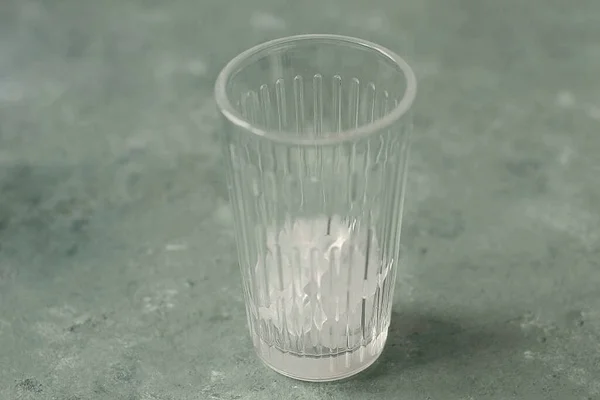 Add ice to a cut glass.